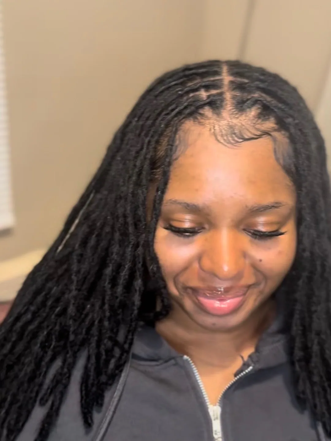 Long locs with a gold cuff